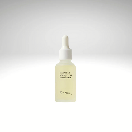 Australian Blue Cypress Face Nectar by Ere Perez in a glass bottle with a dropper, offering daily botanical hydration for glowing skin.