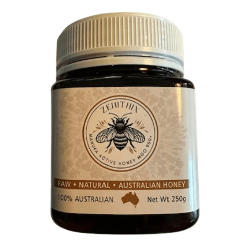 Australian Manuka Honey 900+ MGO 250g jar with label featuring a bee and details on its natural, raw, and high-strength content.