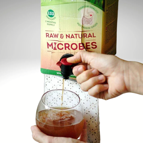 Liquid Probiotics by Probioform being poured from dispenser into glass.